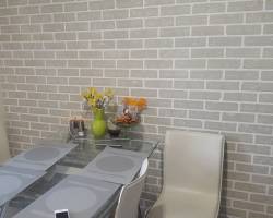 Чем правильнее обшить стены на кухне в частном доме?